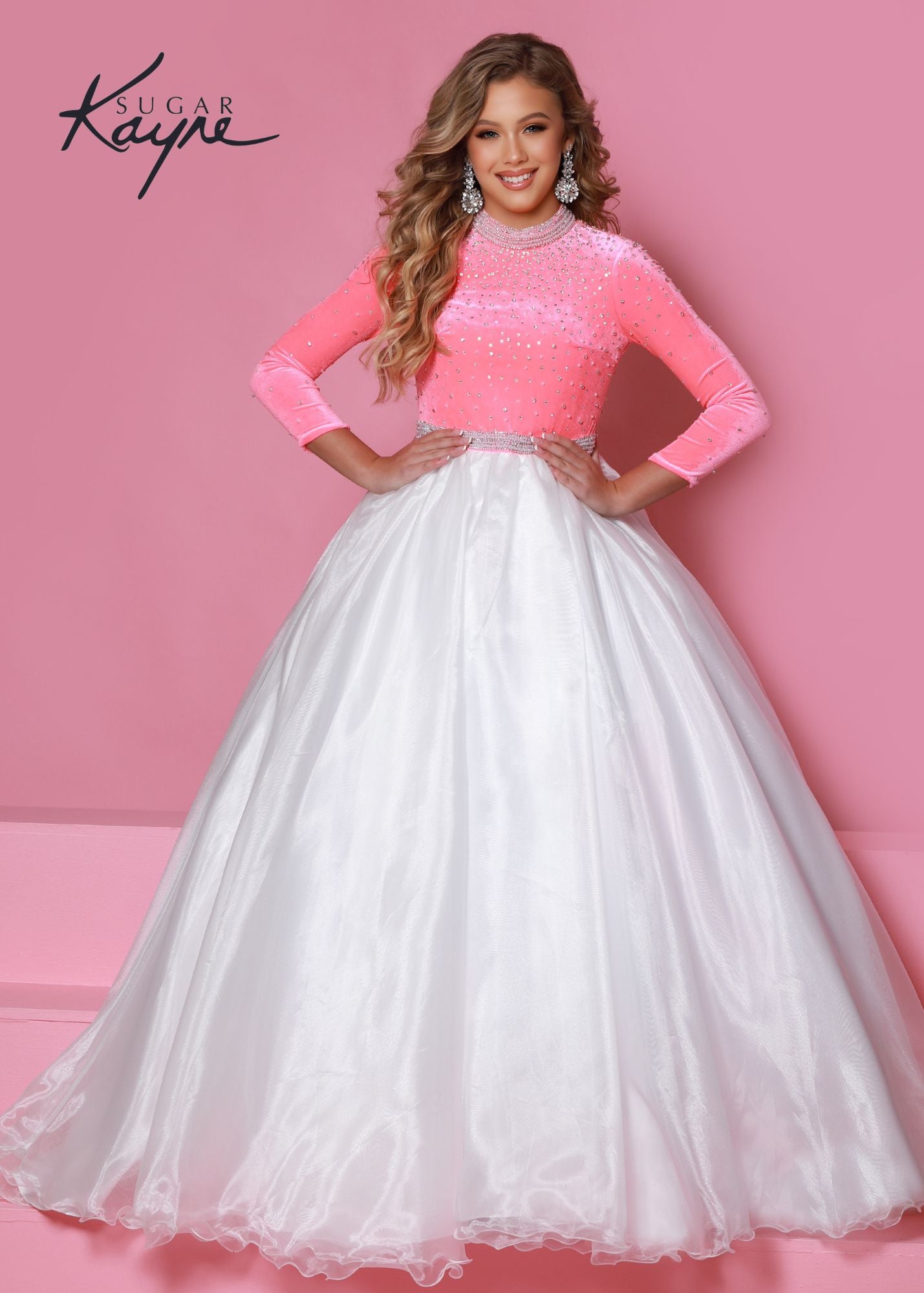 Sugar Kayne C306 Girls Long Sleeve Velvet Bodice Pageant Dress A Line Formal Gown Product Details Perfect in pearls. This long-sleeve color-blocked stretch velvet ballgown is the perfect addition to your closet for your next pageant! The collar and waistband are trimmed with rhinestone and pearls – OH MY!  Color Flamingo-White, Sky Blue-White  Size 2, 4, 6, 8, 10, 12, 14, 16  Fabric Stretch Velvet, Stretch Lining, Organza