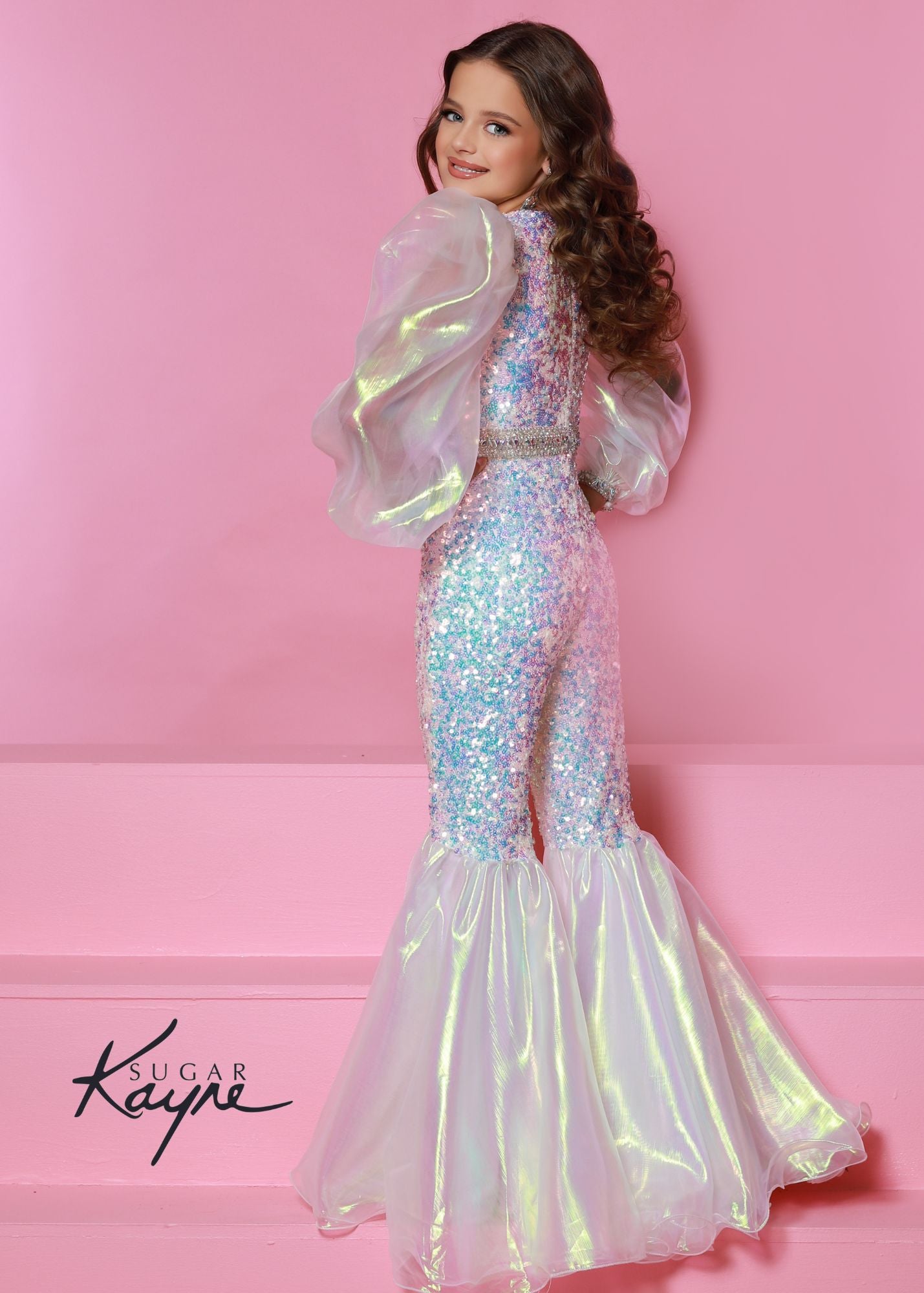 Sugar Kayne C307 Girls Sequin Jumpsuit Bell Bottom Long Sleeve Pageant Fun Fashion Shimmer Product Details Bring back the 70's with this fun fashion bell bottom jumpsuit. The sequin mesh adds the right amount of sparkle to make you glisten on the stage. The look is completed with the iridescent organza puff sleeves.  Colors: Aqua, Pink, White  Sizes: 2, 4, 6, 8, 10, 12, 14, 16  Fabric Sequin Mesh, Stretch Lining, Iridescent Organza