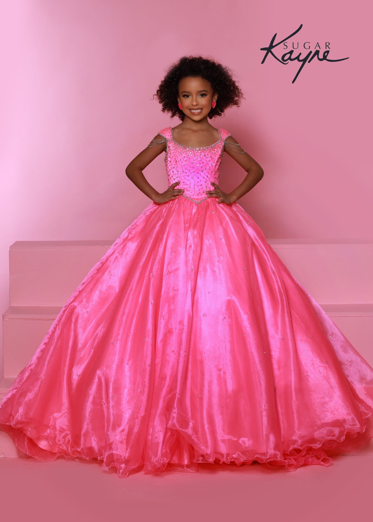 Sugar Kayne C309 Girls Crystal Tassel Cap Sleeve Pageant Dress Long Ball Gown Formal Secure the crown! This organza ballgown features a hand-beaded dropped waist bodice that is sure to elongate the waist. The cap sleeves feature detachable drapes for an extra flare.  Colors: Barbie Pink, Sherbert  Sizes: 2, 4, 6, 8, 10, 12, 14, 16  Fabric Organza, Mesh, Satin Lining