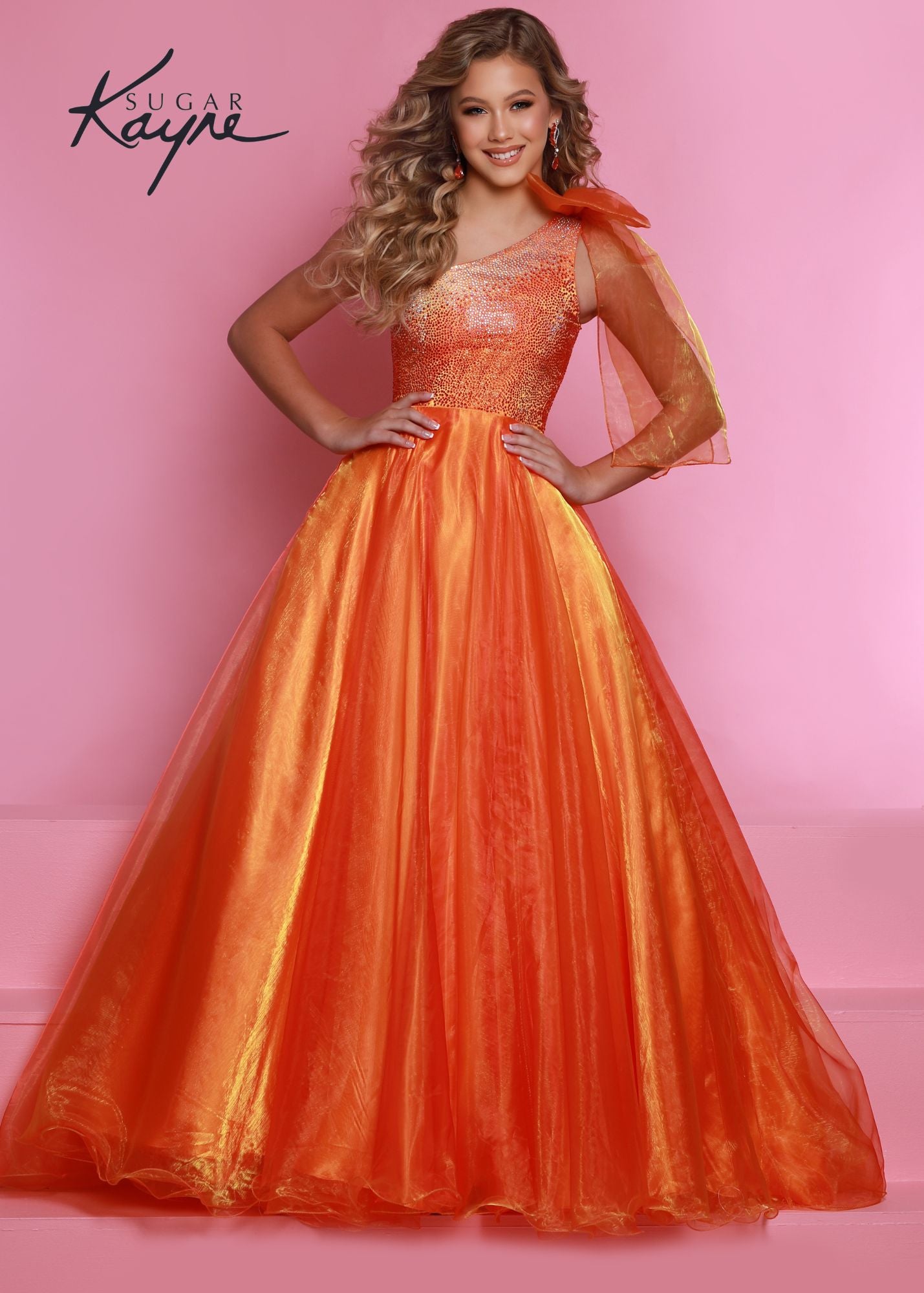 Sugar Kayne C310 Girls One Shoulder Bow A Line Shimmer Pageant Dress Crystal Gown  Go ahead and take a BOW in this lovely one-shoulder organza ballgown. The ombre beaded bodice brings all the dazzle!  Colors: Orange, Yellow, Blue  Sizes: 2, 4, 6, 8, 10, 12, 14, 16  Fabric Organza, Mesh, Satin Lining