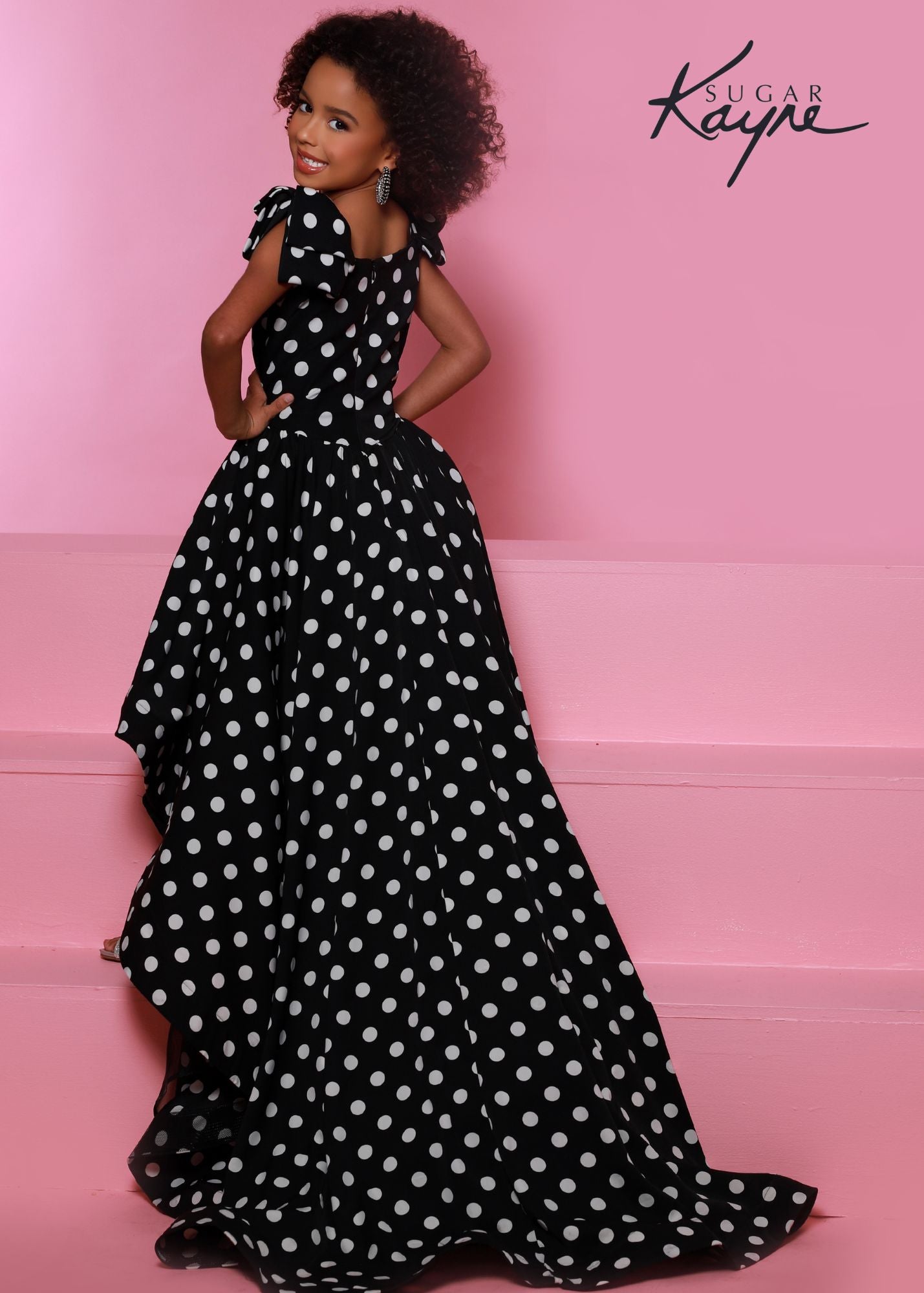 Sugar Kayne C324 Girls High Low Polka Dot Pageant Dress Fun Fashion Formal Wear Train Polka dots are the perfect accessory. Rock your next fun fashion in this hi-low stretch crepe dress. The long train completes the look.  Colors: Black-White  Sizes: 2, 4, 6, 8, 10, 12, 14, 16  Fabric Stretch Crepe, Stretch Lining