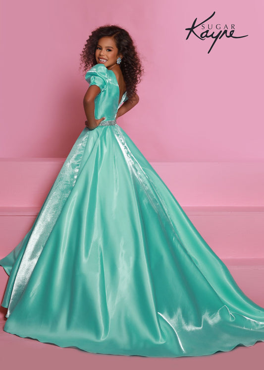 Sugar Kayne C325 short cocktail dress long satin cap sleeve overskirt Pageant Gown Girls Endless possibilities with this shimmer satin dress- make your fit short or long with the detachable beaded belt overskirt!  Colors: Aqua, Cherry, Black, White  Sizes: 2, 4, 6, 8, 10, 12, 14, 16  Fabric Shimmer Satin, Satin Lining