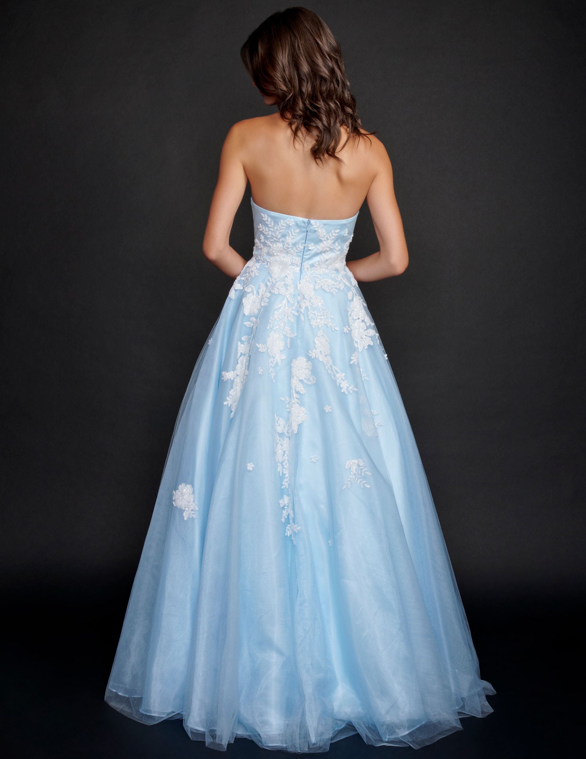 Nina Canacci 9137  This is a strapless ballgown with a sweetheart neckline and 3D floral appliques on the bodice and streaming down the dress. It is good for a Wedding dress or Prom Gown.   Available Size- 4-18  Available Color- Baby Blue, Ivory