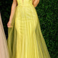 Envious Couture E1412 Karishma Creations is a Long Fitted Glitter Embellished Prom Dress with a tulle over skirt.  This formal evening gown features a Deep Plunging V Neckline.and sheer mid rise back with a sweeping train perfect for you next pageant in popular color of yellow.   Available Sizes: 6  Colors: Yellow