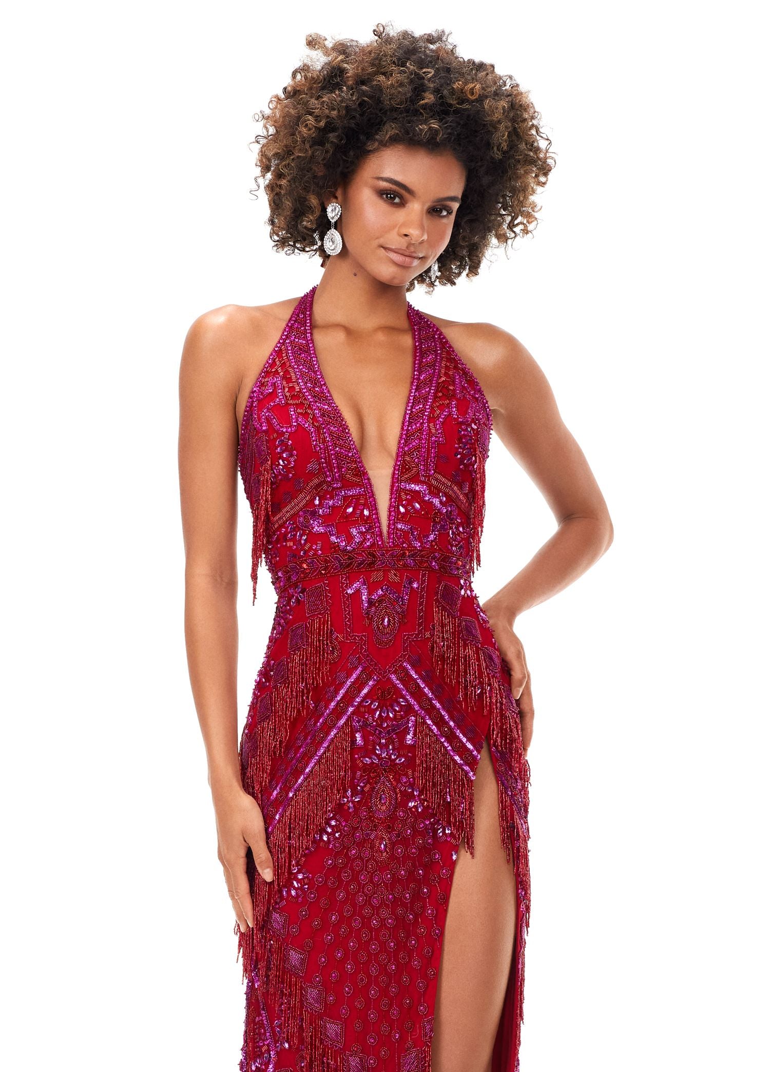 Ashley Lauren 11341 This gown has a deep v-neckline halter top, an intricate bead pattern and fringe accents. The gown is complete with an open back and side slit. Talk about perfection. V-Neckline Open Back Left Leg Slit Fully Hand Beaded COLORS: Red, Gold