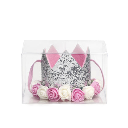 Sweet Wink - The Silver Flower Crown is the perfect addition to any birthday party or everyday dress up! Since this crown does not have a number on it, it can be worn for multiple occasions. Makes a great birthday present for any little girl in your life! Item description:  Silver glitter crown Pink and ivory flowers trim the base of the crown Light pink felt lining inside the crown and on the bottom of the crown to ensure comfort and softness on the child's head Light pink elastic to secure crown to child'