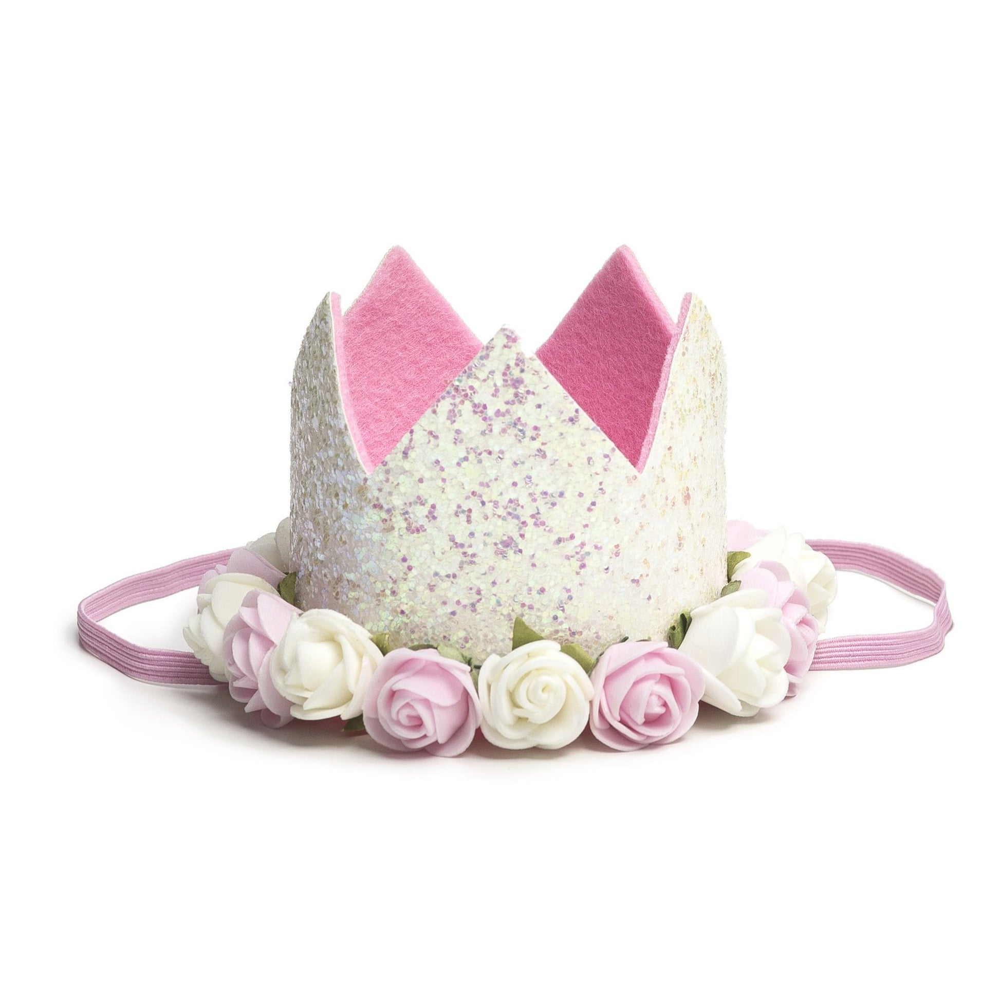 Sweet Wink - The White Flower Crown is the perfect addition to any birthday party or everyday dress up! Since this crown does not have a number on it, it can be worn for multiple occasions. Makes a great birthday present for any little girl in your life! Item description:  White glitter crown Pink and ivory flowers trim the base of the crown Light pink felt lining inside the crown and on the bottom of the crown to ensure comfort and softness on the child's head Light pink elastic to secure crown to child's 