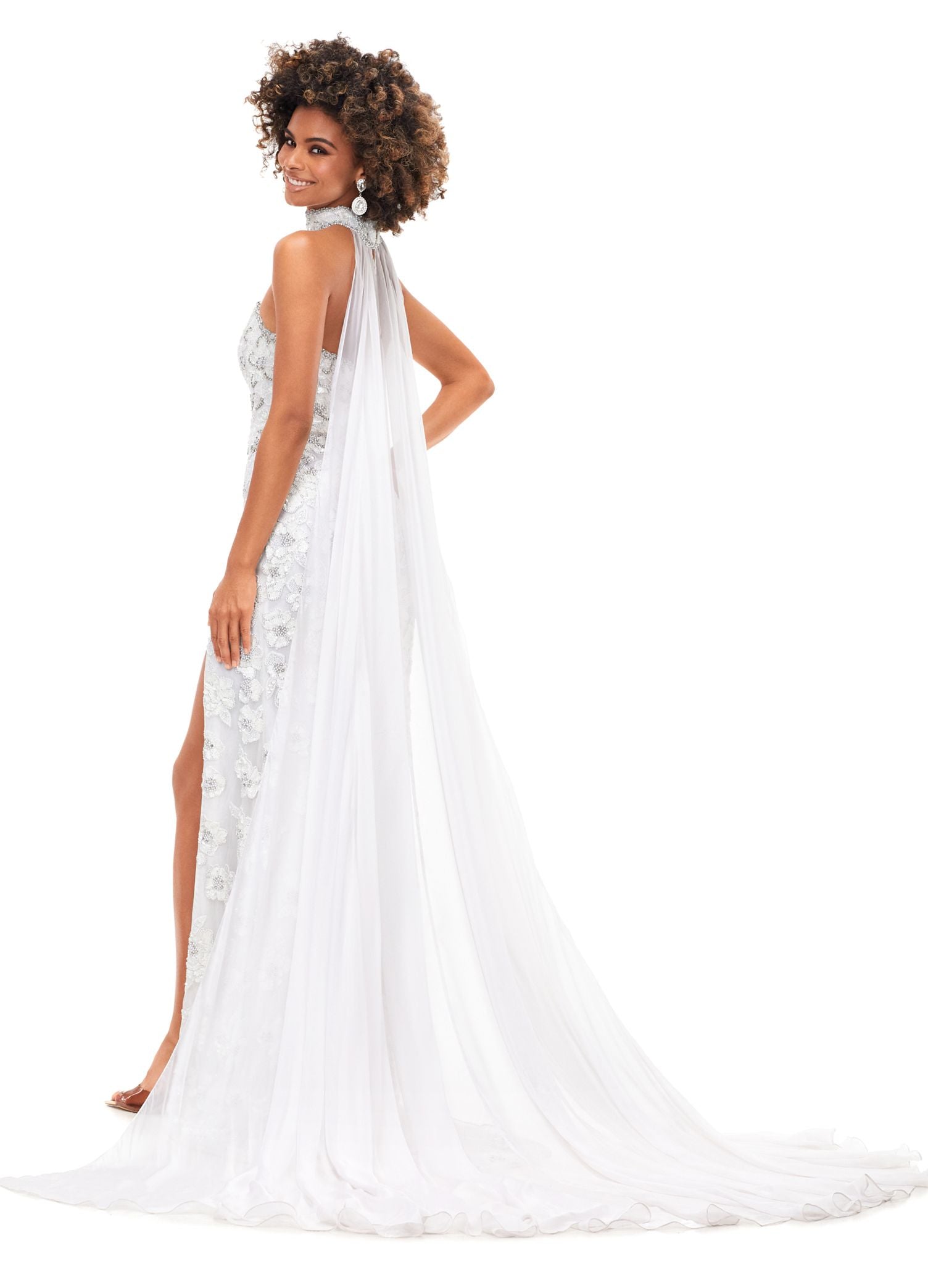 Ashley Lauren 11351 All we can say is WOW! This strapless beaded gown with crystal detailing is sure to make a statement at your next event. The gown features a gorgeous beaded neck choker with attached chiffon cape. Strapless Gown Beaded Choker Chiffon Cape Left Leg Slit COLORS: Royal, Ivory, Red, Neon Pink