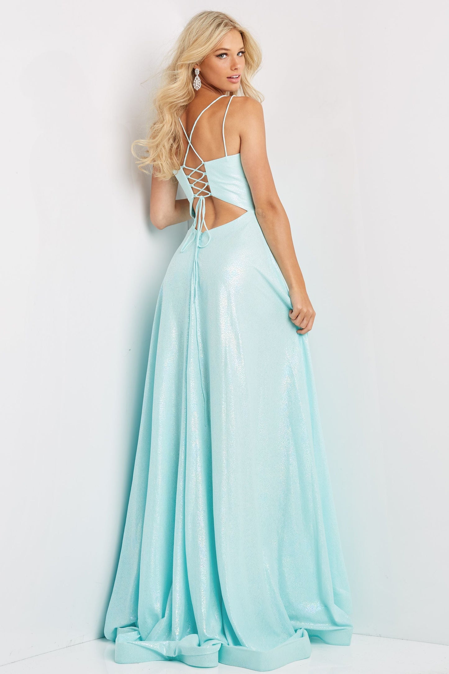Jovani JVN08490  This is a JVN prom dress made by Jovani,  JVN08490 is long party dress featuring an A-line silhouette with a V-neckline, held with double spaghetti straps that form the lace-up back. A contour waistband cinches this trendy prom gown, finished with a horsehair hem and sweep train.  The corset in the back with cutouts helps lace up to fit you superb.