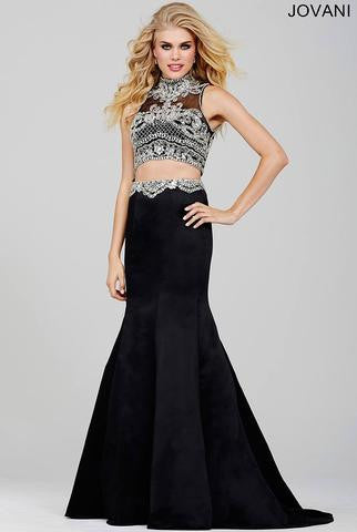 Jovani 33862 Black size 2 This pageant gown is a modern two piece style dress with a long form fitting mermaid skirt that will hug every curve and is made in an elegant satin fabric that is beaded with a stunning belt detail along the waistline that scallops in the edges. The back of this prom dress is a sexy open dome shaped back with beaded straps along the sides and a center back zipper