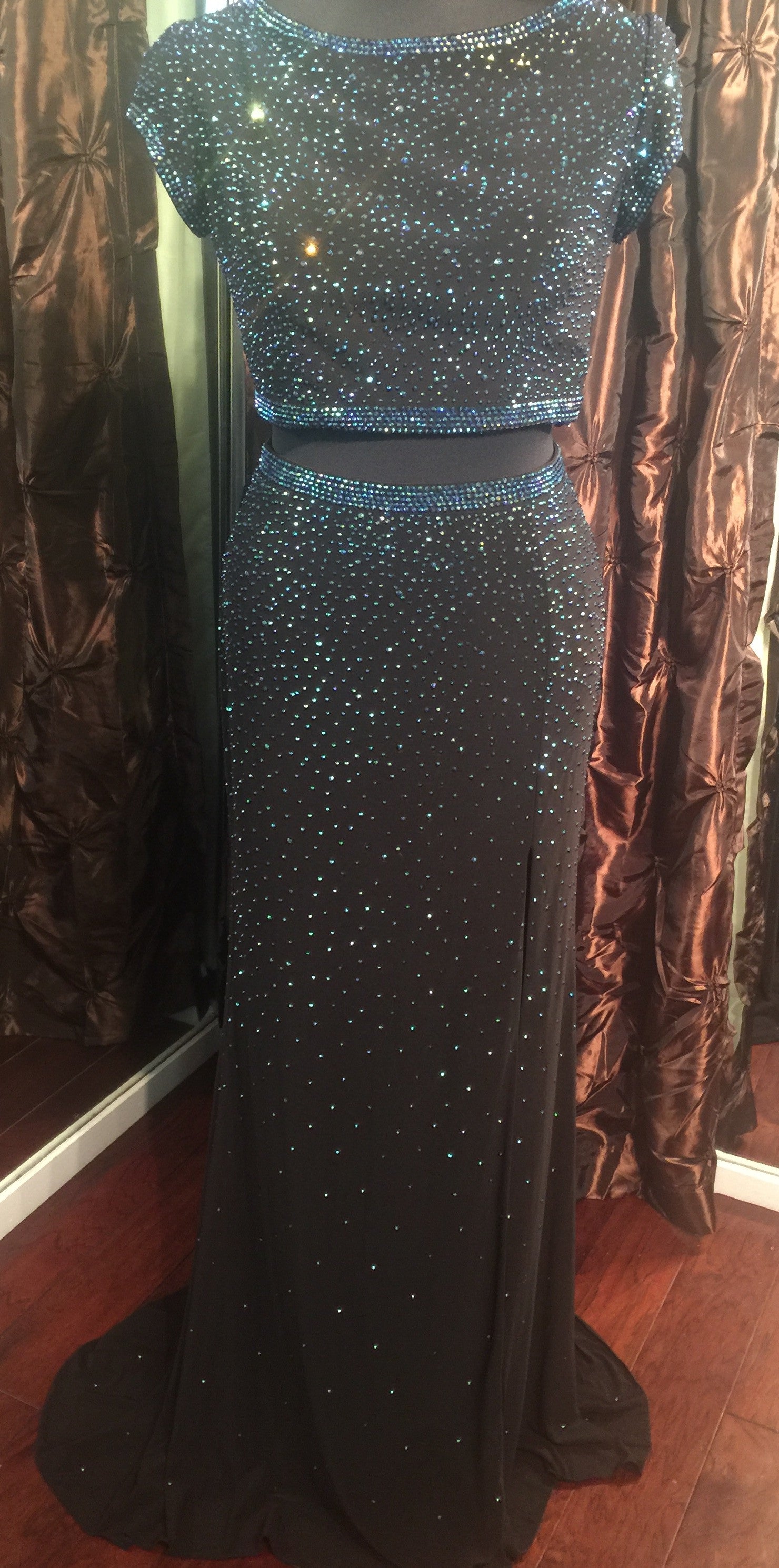Jovani JVN 36743 JVN36743 Beautiful two-piece prom gown features an open back and sexy slit with cap sleeve top and hot stones set throughout for that extra bling.  two piece prom dress cap sleeve slit backless cut out.  Size 10 Black