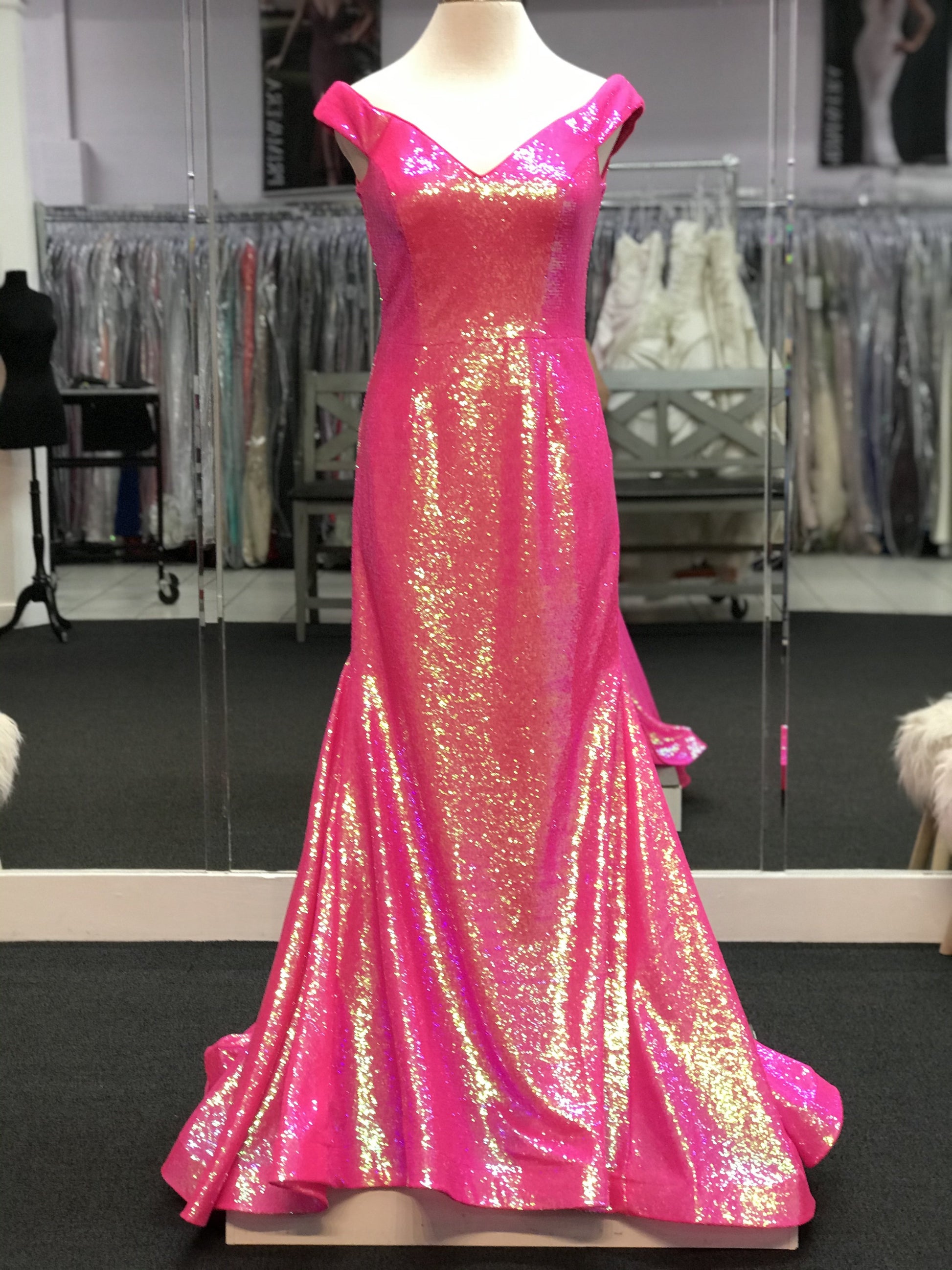 Ashley Lauren 11109 is a long fitted sequin formal prom & Pageant dress. Featuring off the shoulder straps and a lush trumpet skirt with a sweeping train.  Available Sizes: 0-24   Available Colors: Neon Green, AB Ivory, Neon Blue, Neon Pink