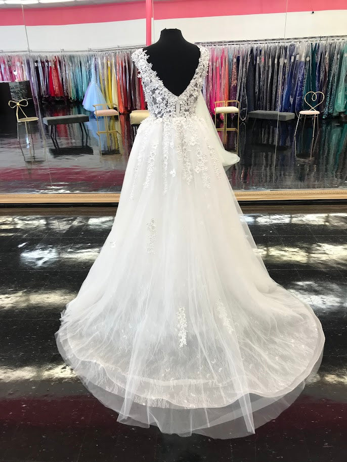 Johnathan Kayne Bridal B105 3D Flower Lace Bridal Gown Overskirt Wedding  Dress High Neck Stunning lace lush overskirt with a sheer high neckline. 3D Floral embellished lace. Bridal Gown, Wedding Dress  Available Color: Blush, Ivory  Available Sizes: 00,0,2,4,6,8,10,12,14,16,18,20,22,24  Chantilly Lace, Mesh, Organza