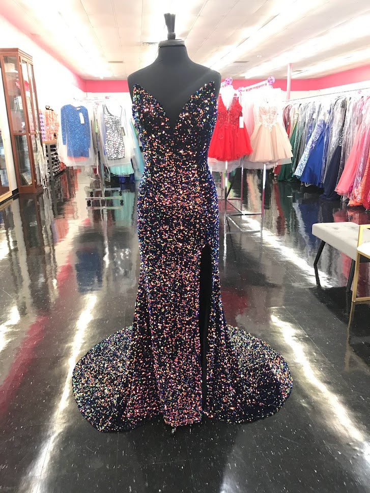 Johnathan Kayne 2529 Sequin Embellished stretch Velvet set off this top style! This Formal Pageant Dress features a high Slit and stage worthy Train! Sharp V Neckline shows this dress is on point!  Sizes: 00, 0, 2, 4, 6, 8, 10, 12, 14, 16  Colors: Cotton Candy, Lemon Lime, Multi, Powder Blue, Orchid, Red, Royal