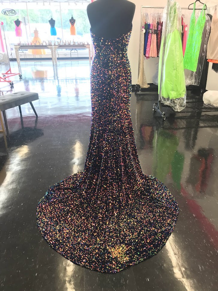 Johnathan Kayne 2529 Sequin Embellished stretch Velvet set off this top style! This Formal Pageant Dress features a high Slit and stage worthy Train! Sharp V Neckline shows this dress is on point!  Sizes: 00, 0, 2, 4, 6, 8, 10, 12, 14, 16  Colors: Cotton Candy, Lemon Lime, Multi, Powder Blue, Orchid, Red, Royal