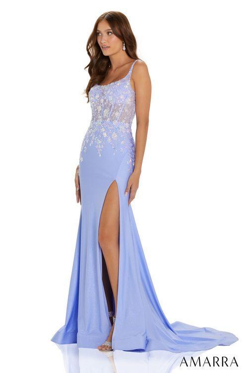 Amarra 88572 Long Fitted Shimmer Sheer Sequin Corset Prom Dress Slit Ruched Formal Gown Are you looking for a glamorous gown to dazzle in? AMARRA 88572 is the dress of your dreams. This stunning prom dress features a fitted bodice with a sheer square neckline and lace-up back, a demure slit skirt, and a machine sequin floral design. If you’re the girl who wants to stand out effortlessly on prom night, this stunning beauty is the perfect way to do it.