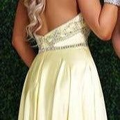 Envious Couture E1404 Karishma Creations is a Long satin A line Prom Dress. High Neck Embellished Bodice with sheer plunging cutout flowing into a satin skirt with pockets.   Available Sizes: 4  Colors: Yellow