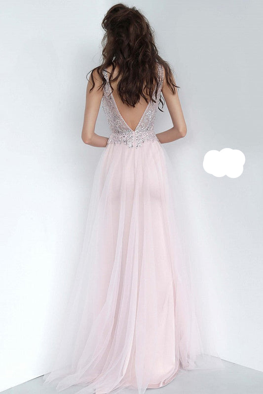 JVN 02253 is a long fitted Prom Dress with a sheer Embellished bodice with a Deep V Plunging Neckline with a mesh insert. Features an open V Back. Fitted Skirt has a tulle overlay overskirt with embellishments cascading from the bodice to add a soft transition. Great pageant gown or Dress for any formal event!