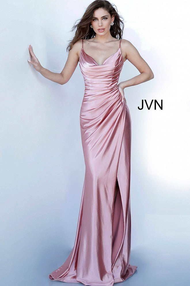 JVN 03104 is a long fitted satin prom dress with an asymmetrical ruched bodice and classy cowl neckline. High Thigh split with a small train in the back.