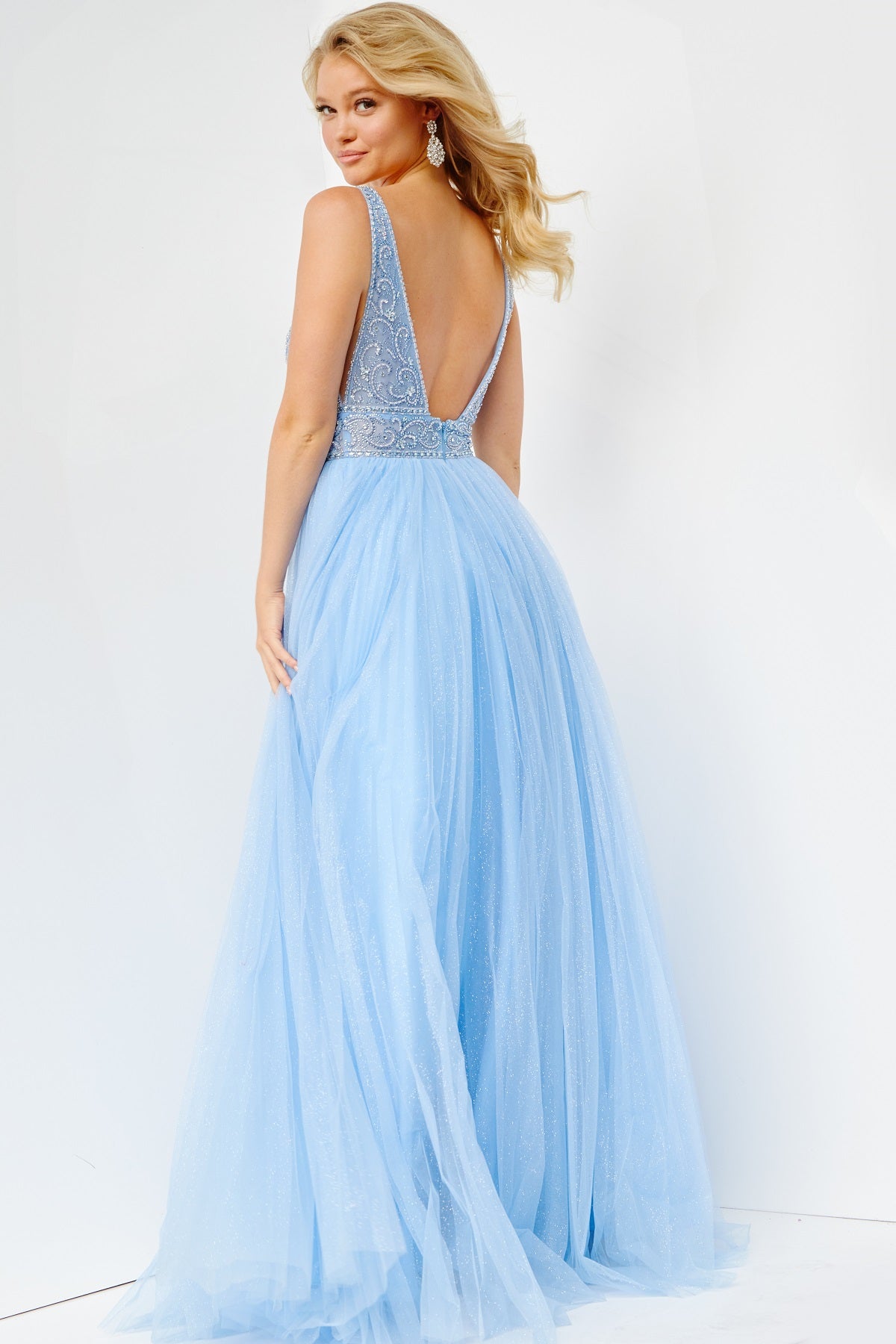 Jovani JVN05818 - JVN 05818 is a Gorgeous Long Glittering Tulle A Line ballgown prom dress. Featuring a sheer Fitted V Neckline bodice with crystal rhinestone embellishments. Open V Back. Look like a princess in this stunning formal evening gown.