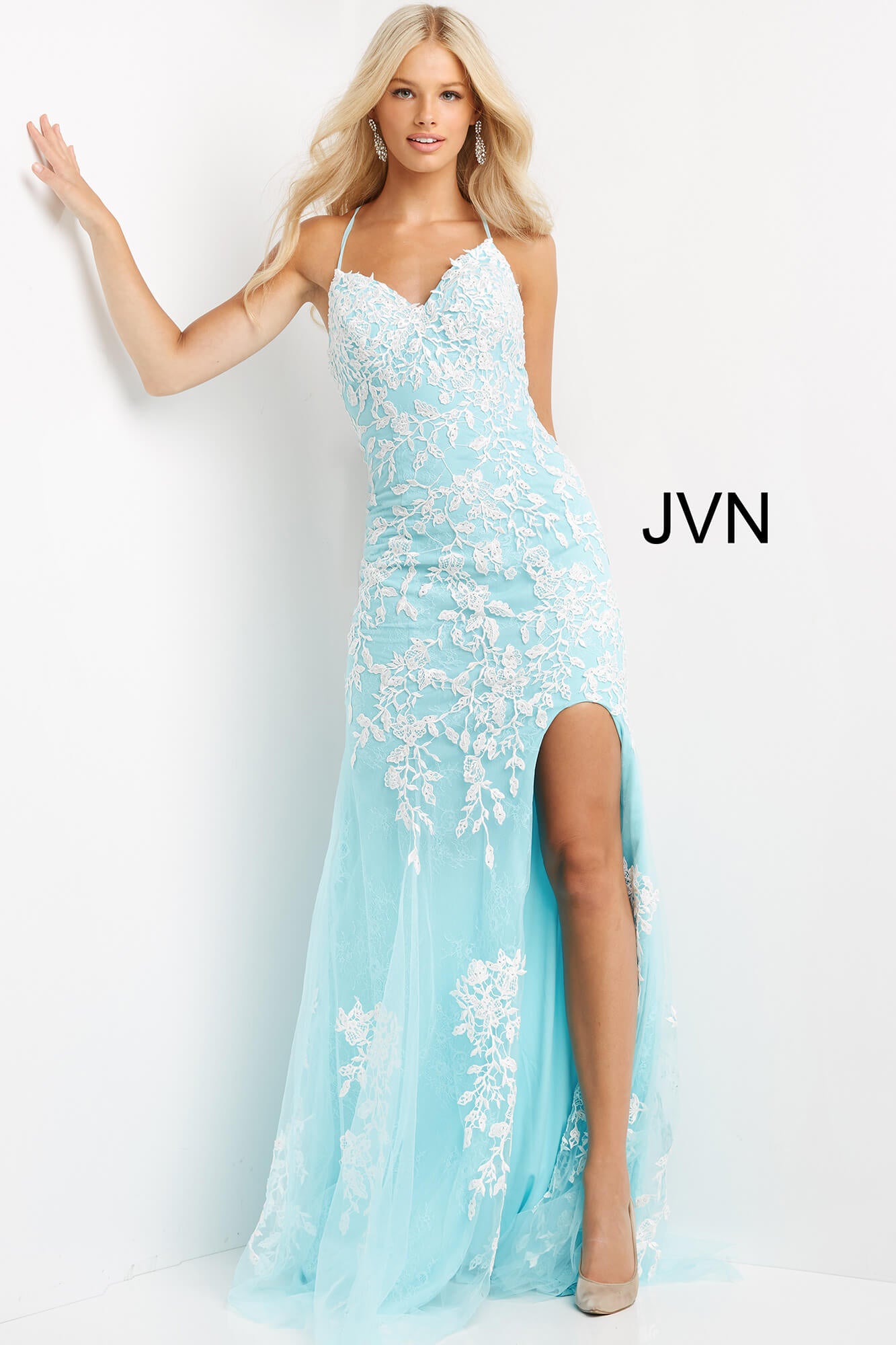 JVN06660-Aqua-White-prom-dress-front-v-neckline-slitJovani JVN06660 - JVN 06660 is a long fitted Lace formal evening gown. This Backless prom dress with a lace up corset back closure features floral lace appliques embellished with crystal rhinestones over a lace layer. Fit & Flare Silhouette with a lush sweeping train and a wide thigh slit.