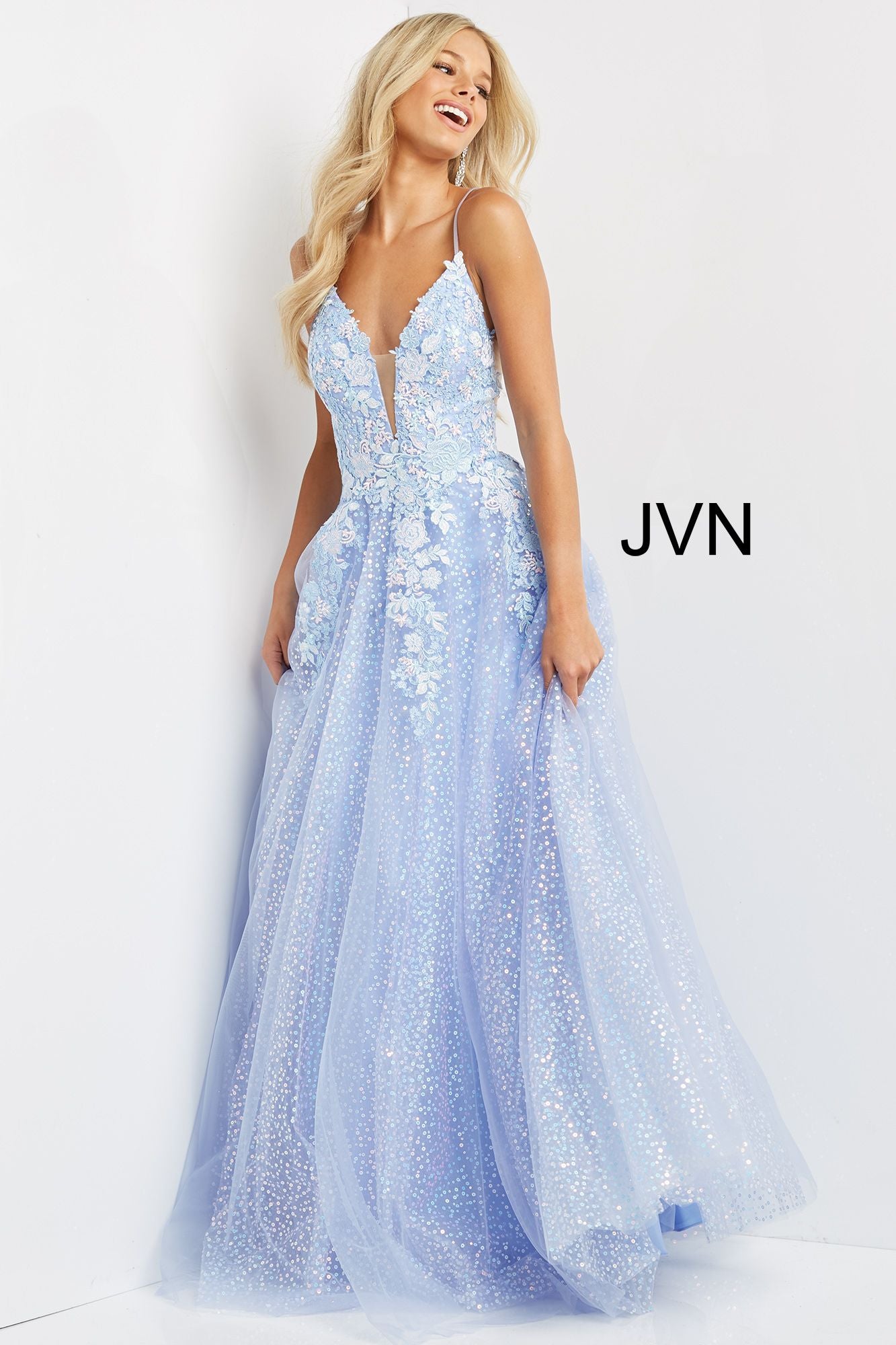 JVN07252A_FRONT-perriwinkle-blue-prom-dress-A-Line-sparkleJVN07252 Periwinkle Prom Dress.  Do you love flowers and periwinkle?  Then this prom dress is for you.  It is an A line dress with sequin underlay long skirt.  The bodice has a low v neckline with sheer courtesy panel.  The bodice is covered in floral appliques that stream down the dress.  Available color:  Periwinkle  Available sizes:  00-24 