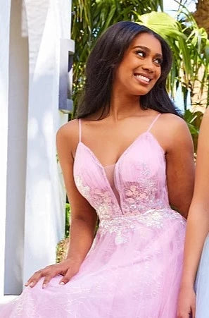 JVN07637  A Line Prom Dress.  Can you see yourself in this evening dress?  It has plunging v neckline with sheer courtesy panel.  The bodice is ruched and has floral appliques at the waistline.  The long A line skirt has horsehair trim and a glitter underlay. Lavender lilac
