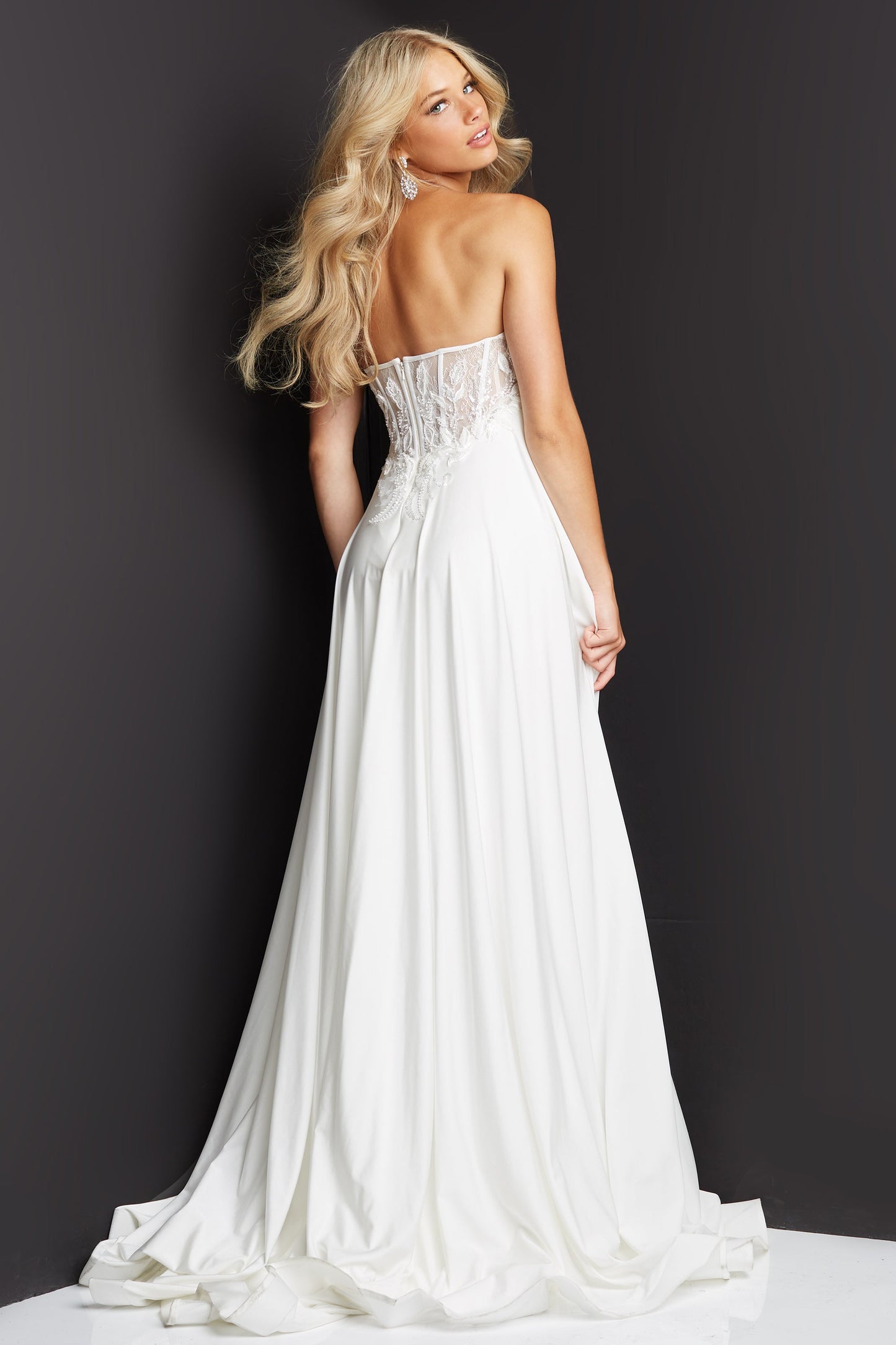JVN07648 Long Flowy Prom Dress Pageant Gown. Strapless with Ruching and a high slit.  Would make a nice informal wedding dress.   Size 8 Ivory  Available Size-00-24  Available Color- Black, Ivory  JVN 07648