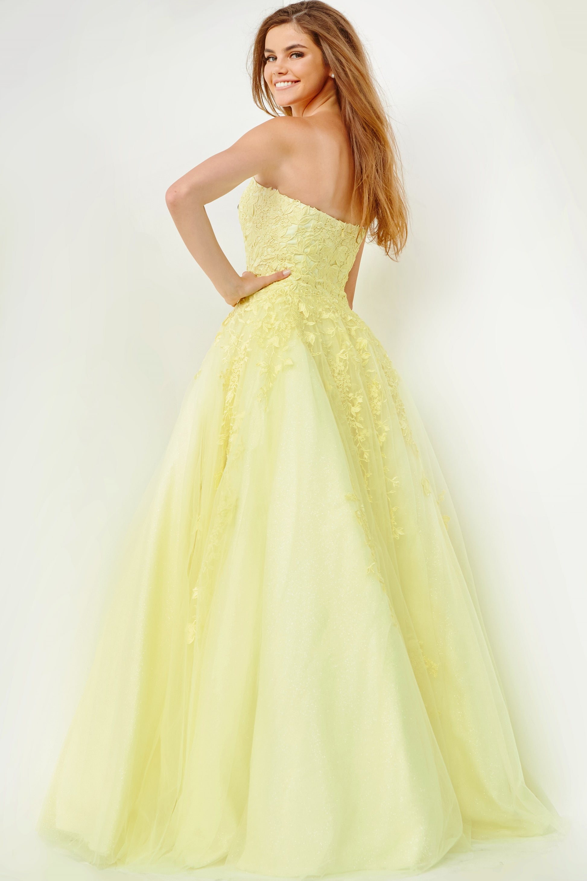Jovani JVN1831 is a Long Tulle Ball Gown Prom Dress with a fitted strapless bodice with floral embroidering. Embroidering cascades down into the skirt of this ballgown evening gown. Also makes a perfect informal wedding dress. JVN by Jovani 1831 