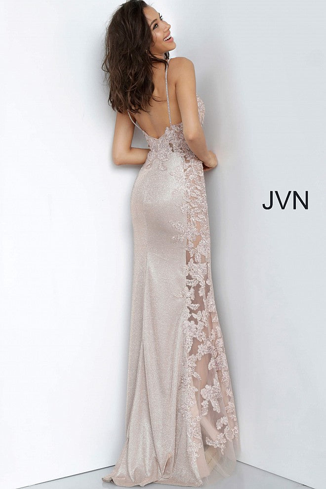 Jovani JVN2205 Is a Beautiful Shimmery Prom Dress! Iridescent Shimmer Skirt is accented by a sheer Bodice with Lace & Crystal Embellishments. This Cascades down the side of the skirt. Absolutely breath taking in person! JVN 2205  Details: Glitter prom dress, form fitting silhouette, floor length skirt with sheer embroidered side panel, sheer floral embroidered bodice, bra cups, embellished spaghetti straps over shoulders, V neckline, open back Available at Glass Slipper Formals Lake City FL