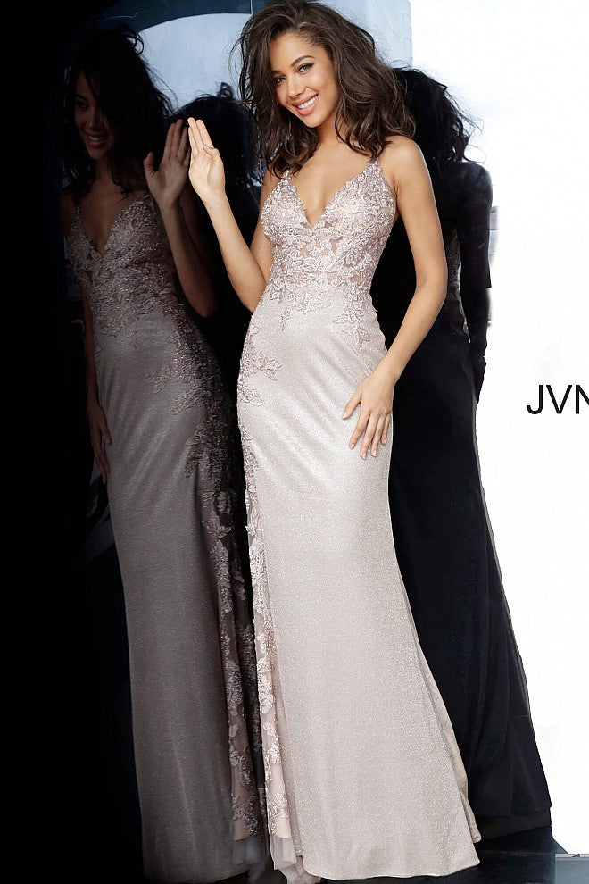 JVN 2205 Is a Beautiful Shimmery Prom Dress! Iridescent Shimmer Skirt is accented by a sheer Bodice with Lace & Crystal Embellishments. This Cascades down the side of the skirt. Absolutely breath taking in person!