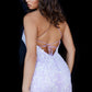 Jovani JVN22514 This JVN by Jovani short cocktail dress is fashioned in allover lace, with a sweetheart neckline and spaghetti straps that tie at the open back. Beaded lace appliques encrust this fitted homecomin