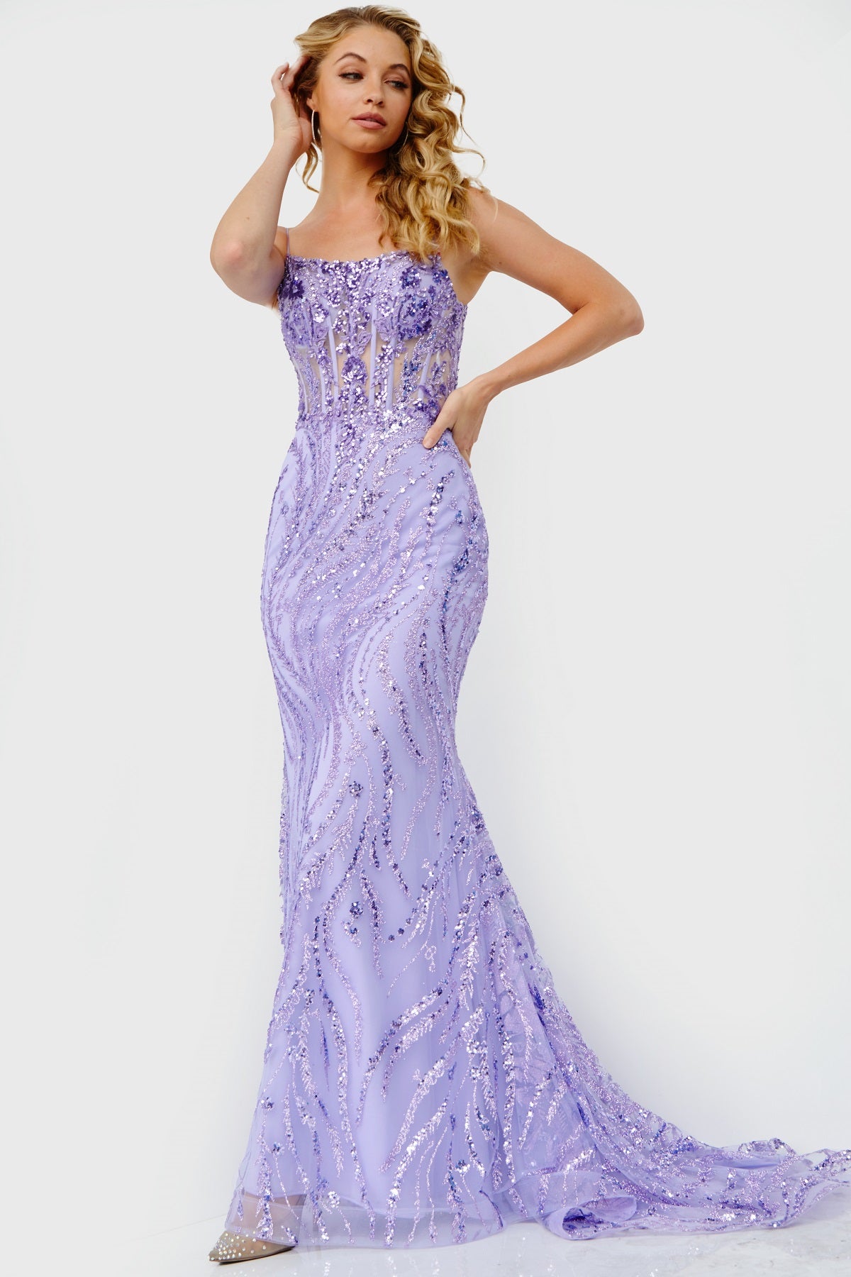This spectacular Jovani JVN23250 piece flaunts a glitter and sequin-embellished bodice and sparkling train with horsehair trim, offering a form-fitting silhouette ideal for your prom dress.  Colors:  Lilac, Light Blue