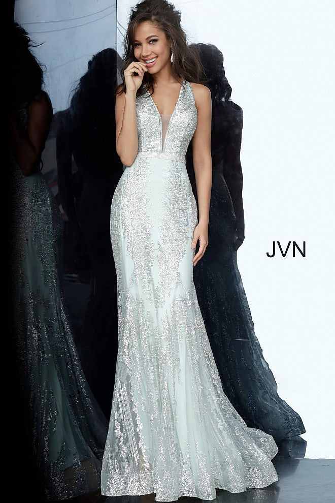 Jovani JVN 3663 is a long Form Fitting Mermaid silhouette prom dress, Pageant gown & evening formal wear. Featuring a plunging neckline with crystal embellishments along the straps, edges of bodice & waist belt. Open back with crystal embellished straps. Full mermaid flare skirt. JVN3663  Available Colors: Mint, Pink  Available Sizes: 00-24
