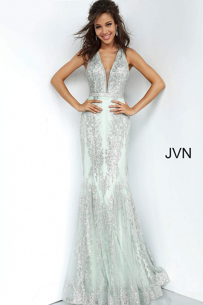  JVN 3663 is a long Form Fitting Mermaid silhouette prom dress, Pageant gown & evening formal wear. Featuring a plunging neckline with crystal embellishments along the straps, edges of bodice & waist belt. Open back with crystal embellished straps. Full mermaid flare skirt.