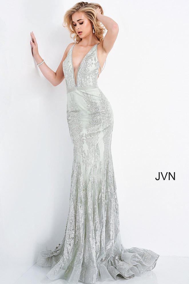 Jovani JVN 3663 is a long Form Fitting Mermaid silhouette prom dress, Pageant gown & evening formal wear. Featuring a plunging neckline with crystal embellishments along the straps, edges of bodice & waist belt. Open back with crystal embellished straps. Full mermaid flare skirt. JVN3663  Available Colors: Mint, Pink  Available Sizes: 00-24