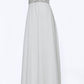 JVN4410 JVN 4410 is a long flowy pageant gown prom dress. Featuring a sheer embellished bodice and open back with with a V neckline and spaghetti straps. Flowing chiffon skirt with slit evening gown. 