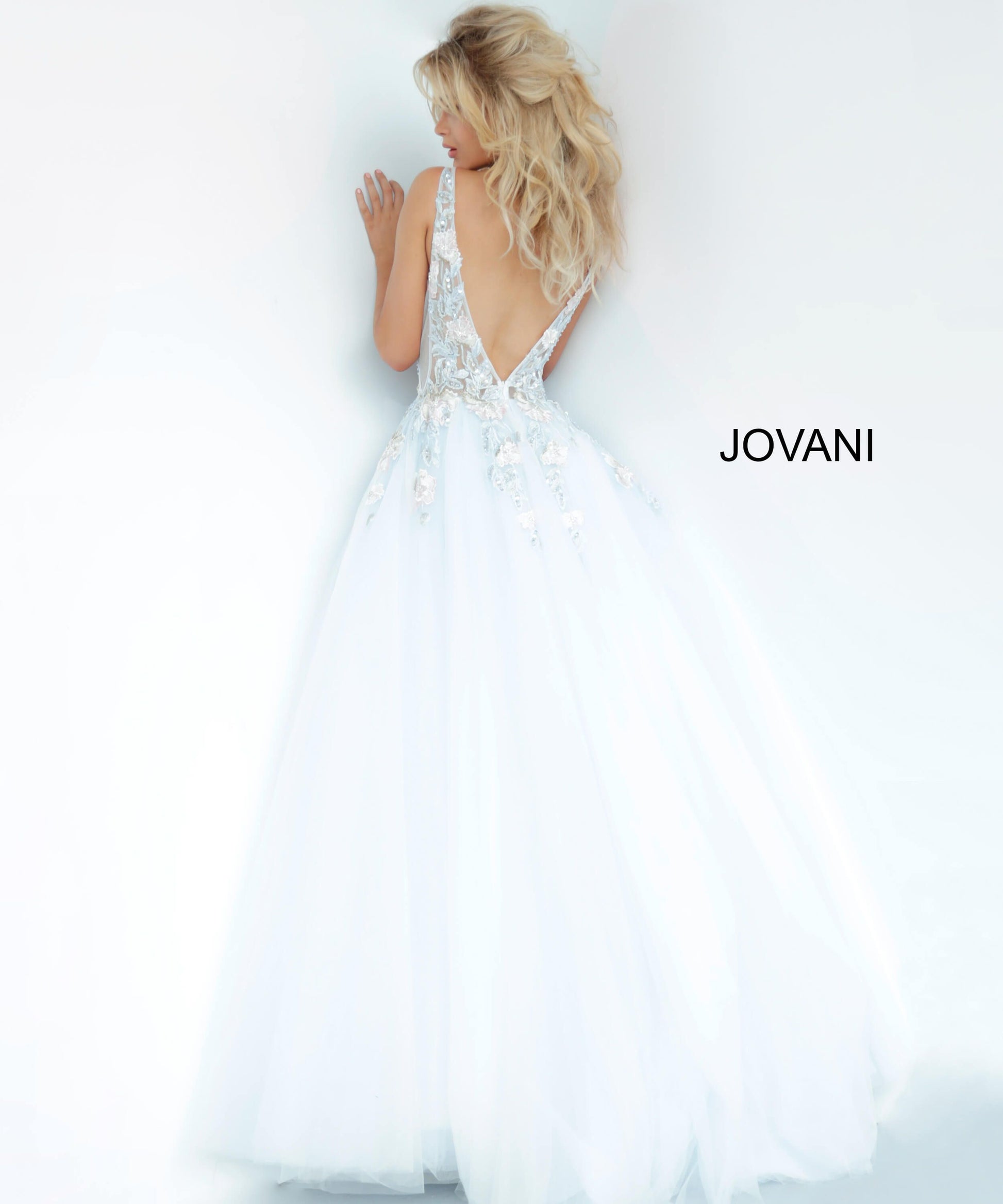 Jovani 11092 floral embellished plunging neckline tulle prom dress ball gown evening dress. Long Sheer floral lace applique embellished formal ball gown evening. Prom Dress, Pageant Gown.  Light blue tulle prom ballgown with floral embroidered bodice featuring a sheer sleeveless bodice, plunging neckline and low v-shaped back with zipper, floor-length A-line skirt. Available colors:  Blush, Light Blue