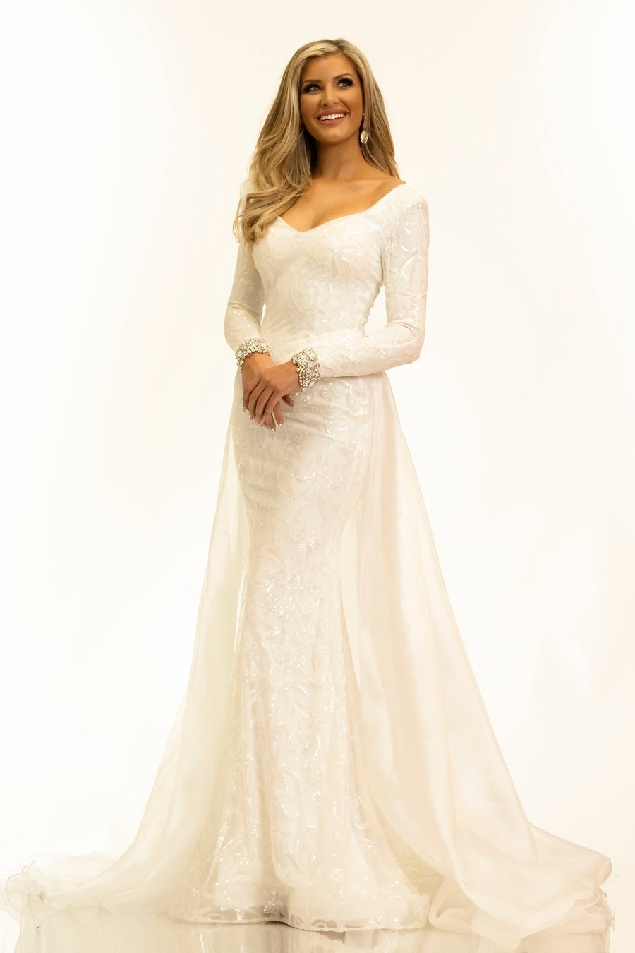 Johnathan-Kayne-2334-ivory-pageant-dress-front-long-sleeves-embellished-overskirt