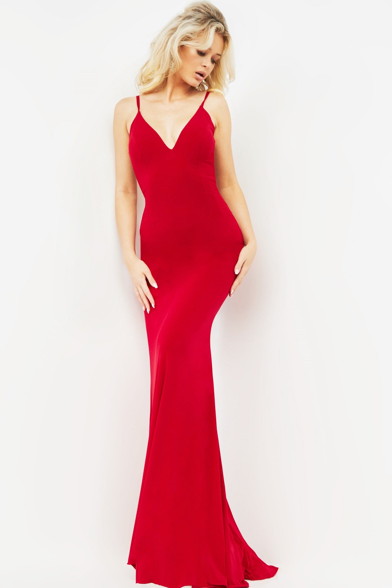 Jovani 00512 plunging v neckline fitted mermaid prom dress evening gown pageant dress has an open back with multiple straps that cross to create a dramatic effect.  Ruching at the lower back to give a little extra lushness and a small sweeping train. 