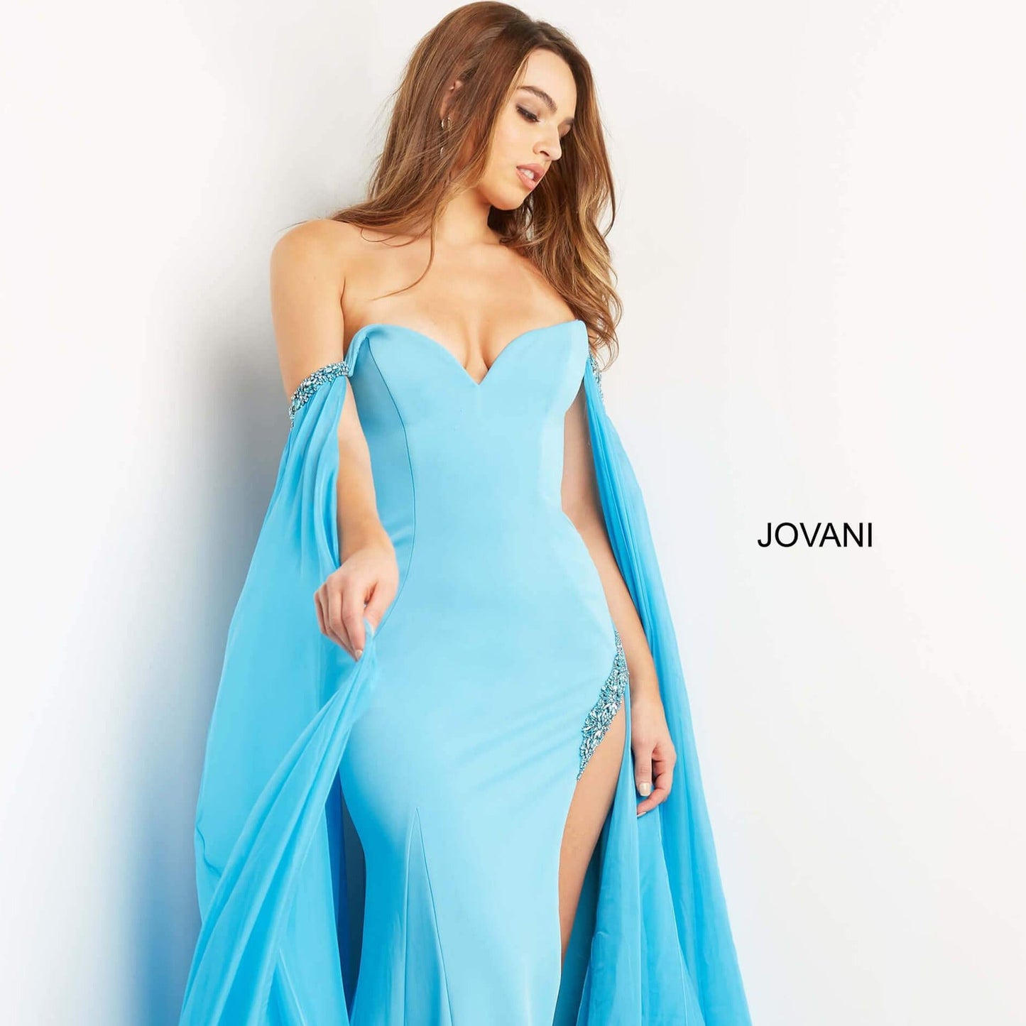Jovani-07652-turquoise-blue-prom-dress-off-the-shoulder-strapless-flowy-cape-sleeves-fitted-side-slit
