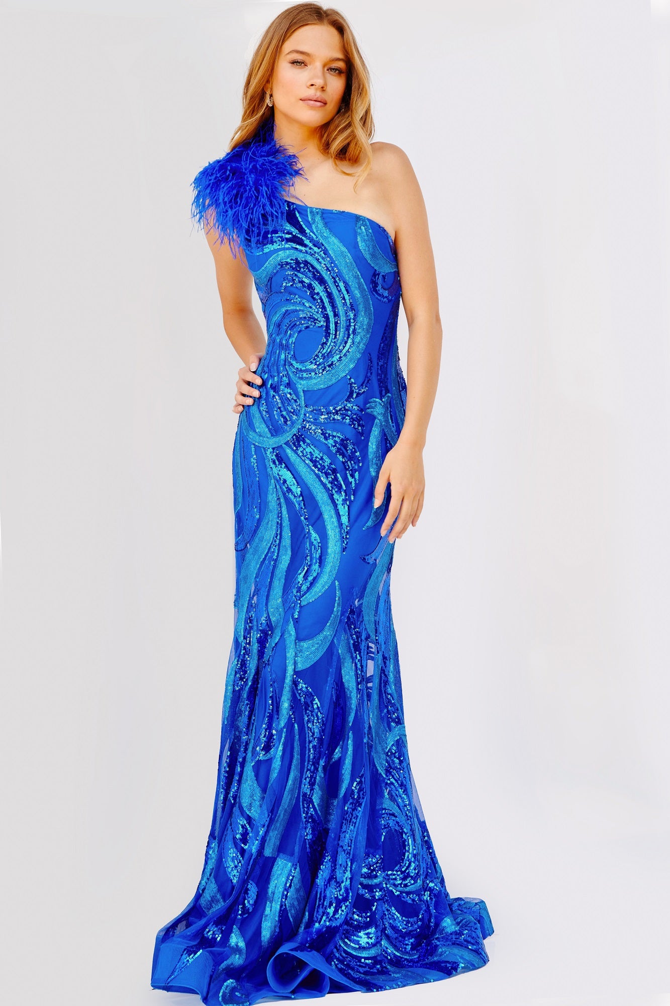 Jovani 32596 This exquisite prom dress features form-fitting sequin embellishments, a floor-length skirt with a sweeping train, and a one-shoulder feather strap for a dazzling look.