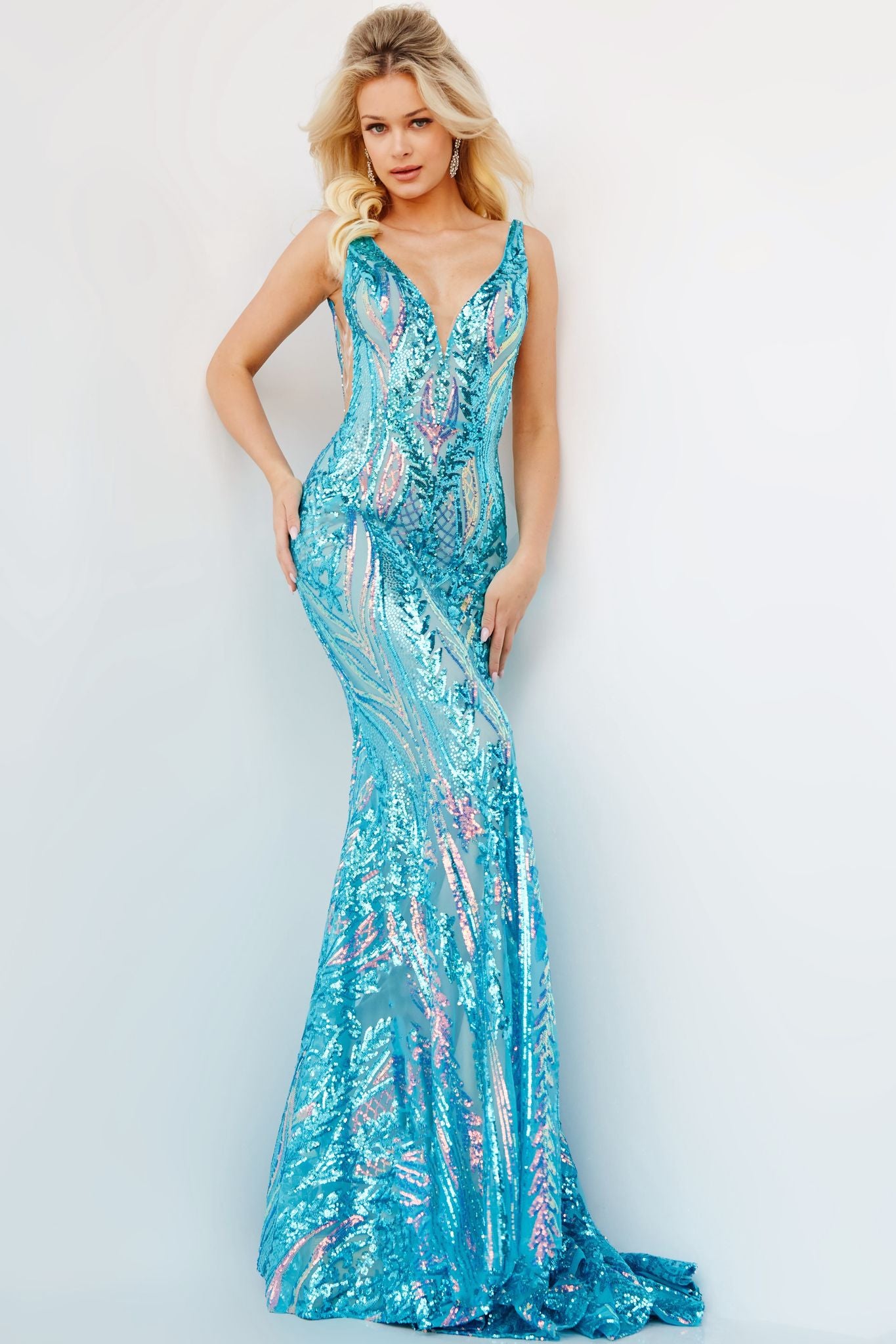 Jovani 22770 Long Fitted Iridescent Mermaid Prom Dress V Neck Sheer Sequin Pageant Gown The Jovani 22770 dress features an iridescent sequin finish, a long fitted silhouette, plus a deep V neck and sheer back. Crafted with premium materials, this stunning prom gown is perfect for any special occasion.  Sizes: 00-24  Colors: Iridescent Jade, Iridescent Hot Pink