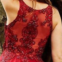 JVN59046 close up photo of the exquisite embellished lace appliques on this burgundy prom dress ball gown evening dress