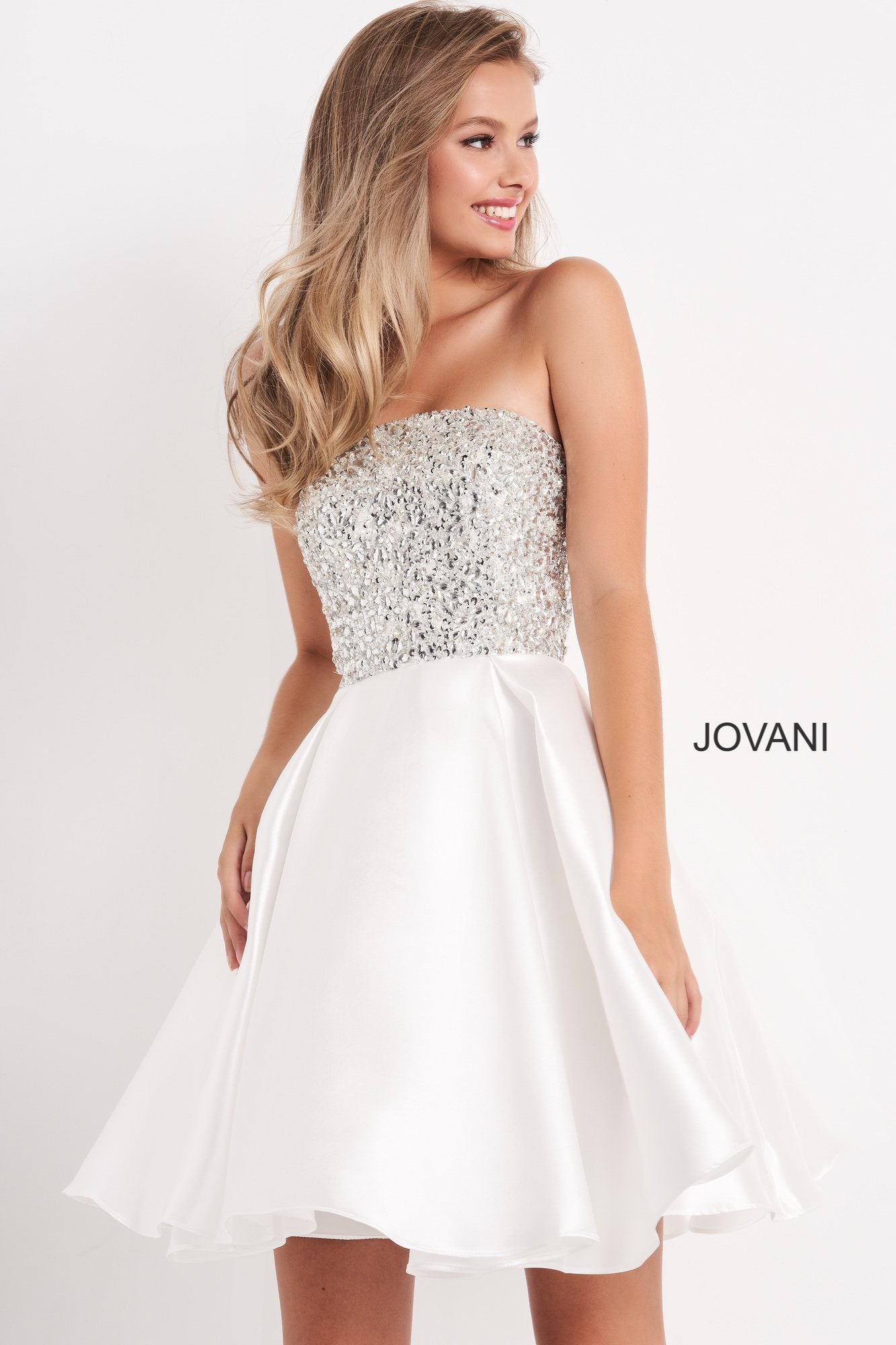 Jovani Kids k00722 is a short Girls Party Dress, Kids Pageant Gown & Pre Teen Formal Evening Wear gown. This Gorgeous Girls Fit & Flare Formal Cocktail Dress Features a strapless straight neckline with a fitted Crystal Embellished Bodice for a Stunning Glam Effect. Flared Short skirt is Pleated.