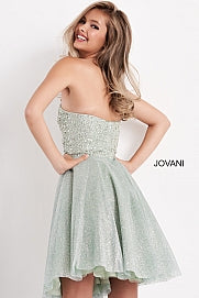 Jovani Kids K04445 This is a short strapless cocktail dress for girls and preteens. It is strapless and has a straight neckline. The bodice is embellished and the skirt is shimmer. This glamorous fit & flare silhouette creates the perfect hourglass shape, perfect for special occasions. The luxurious shimmer fabric is sure to capture all of the lights and attention.