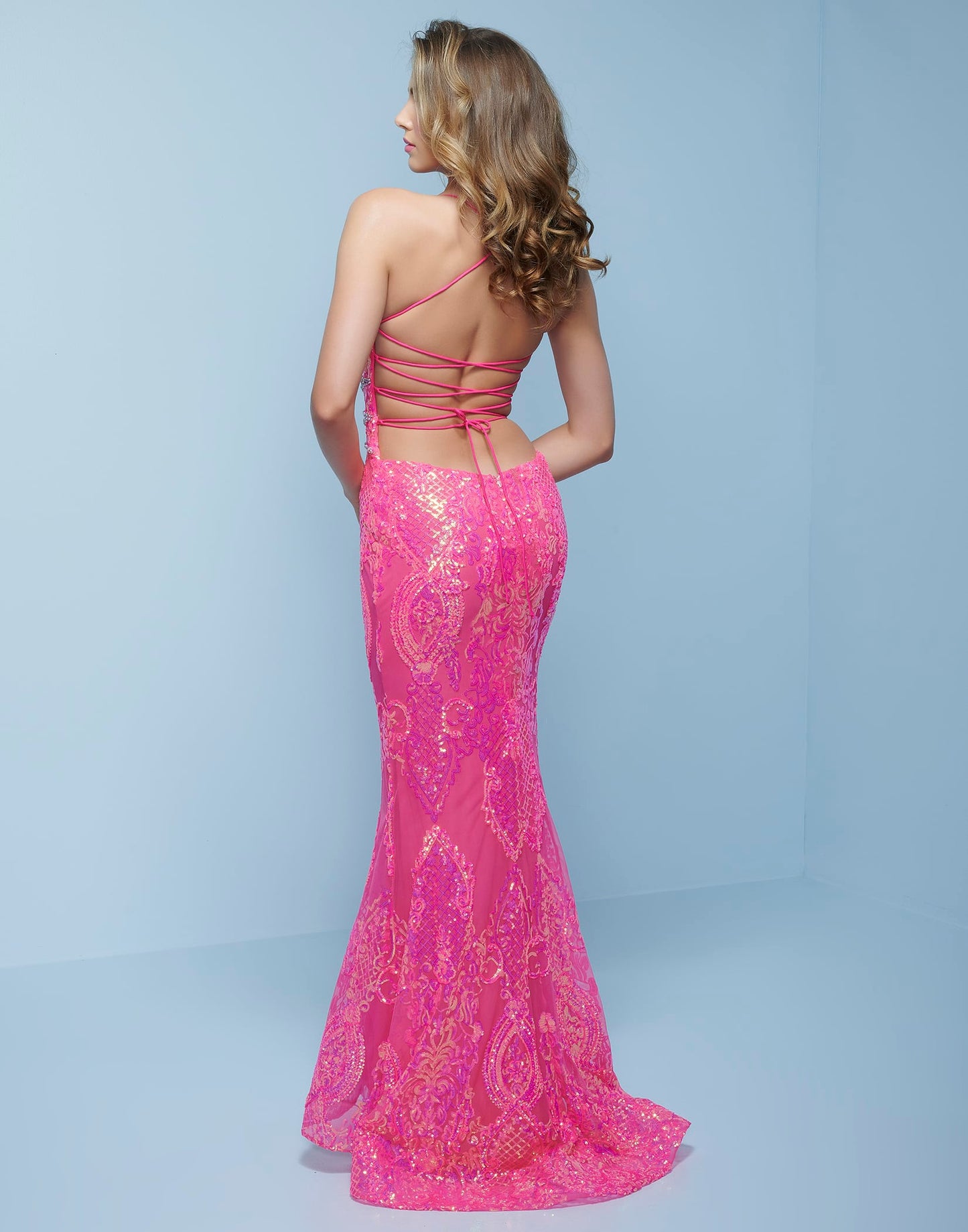 Splash Prom K526 This is a neon sequin column prom dress with low open lace up tie back.  This evening pageant gown features a plunging v neckline with criss cross beading in the front. Colors Neon Pink, Neon Blue Sizes  00, 0, 2, 4, 6, 8, 10, 12, 14, 16, 18, 20, 22, 24, 26, 28