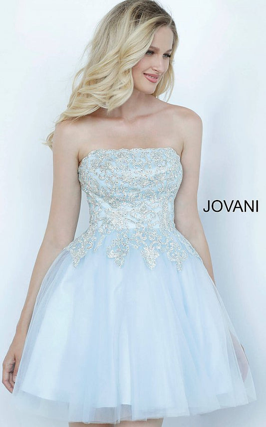 Jovani Kids k66720 is a Short Girls Party Dress, Kids Pageant Gown & Pre Teen Formal Evening Wear gown. This Strapless Straight neckline Girls Gown Features an Embellished Embroidered Applique for a stunning scallop Bedazzled Bodice with a classic look. Flared Tulle skirt.  Available Girls Sizes: 8, 10, 12, 14  Available Colors: Pale Pale Blue, White