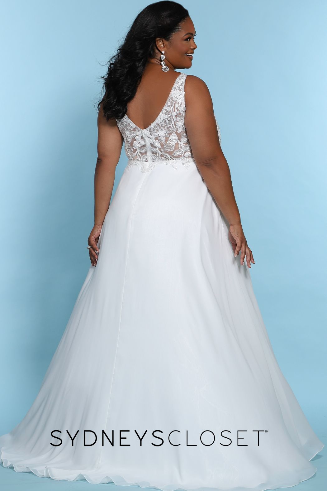 Sydney's Closet SC 5246  Float in chiffon with every step on the day of your dreams! The v-neckline bodice is adorned with floral embroidery, sequins & beading. Add a hint to the sultry factor with a mesh back along the center-back zipper, optional lining included, and the a line silhouette slit starting 15 inches below the natural waistline. Final additions of bra-friendly straps and the ever so popular pockets. SC5246