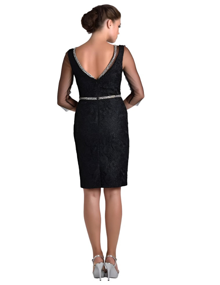 Nina Canacci M215 is a stunning knee length black formal evening cocktail dress. Featuiring a crystal embellished waist belt &amp; Bust edges. Sheer 3/4 tulle sleeves &amp; Sheer illusion Embellished high neckline.&nbsp; Fitted short formal evening gown